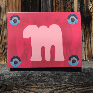 Schokoladenverpackung mit dem Buchstaben "m" in einem Blogbeitrag über kreative Geschenke.